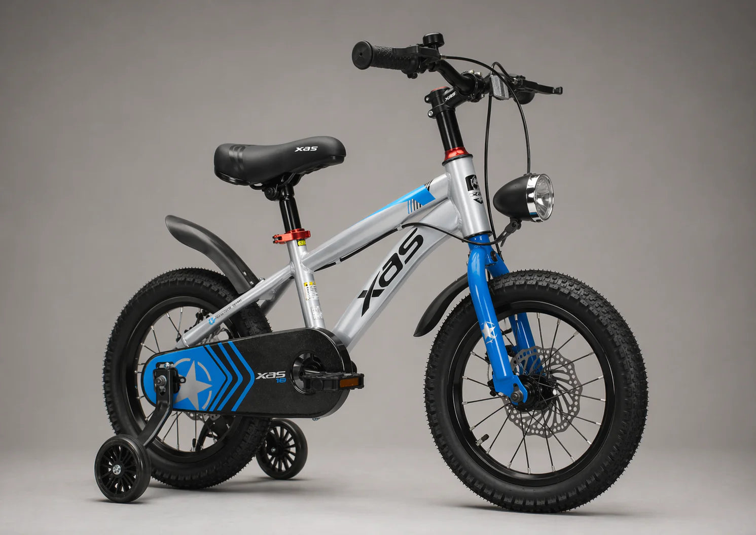 Children's bicycle with training wheels on a gray background